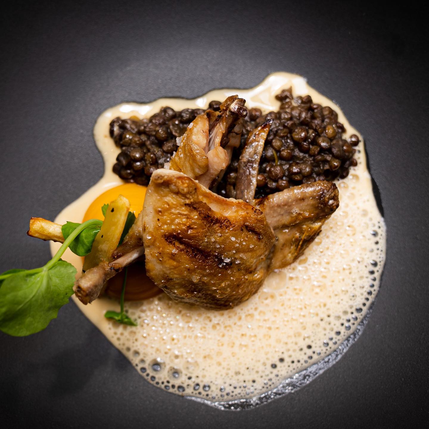 Roasted quail with lentils and carrots at Restaurant Bussia.