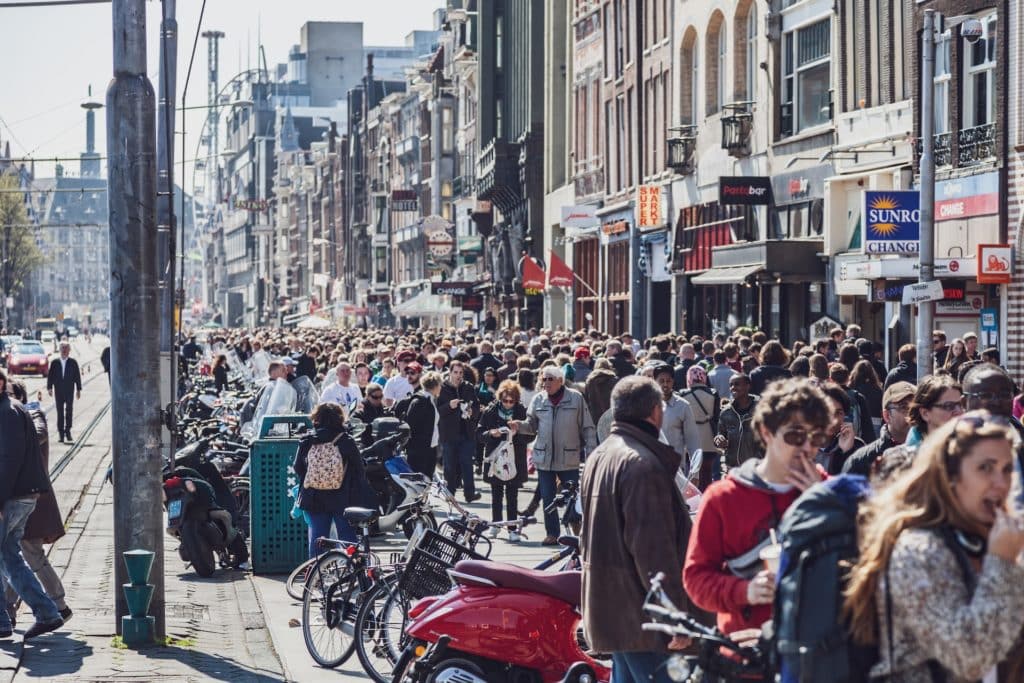 A huge crowd of tourists in Amsterdam.